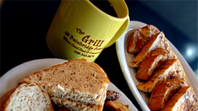 A fluffy omelet, toast, and home fries are joined by French toast and a cup o' joe for a diner-style breakfast quintet.