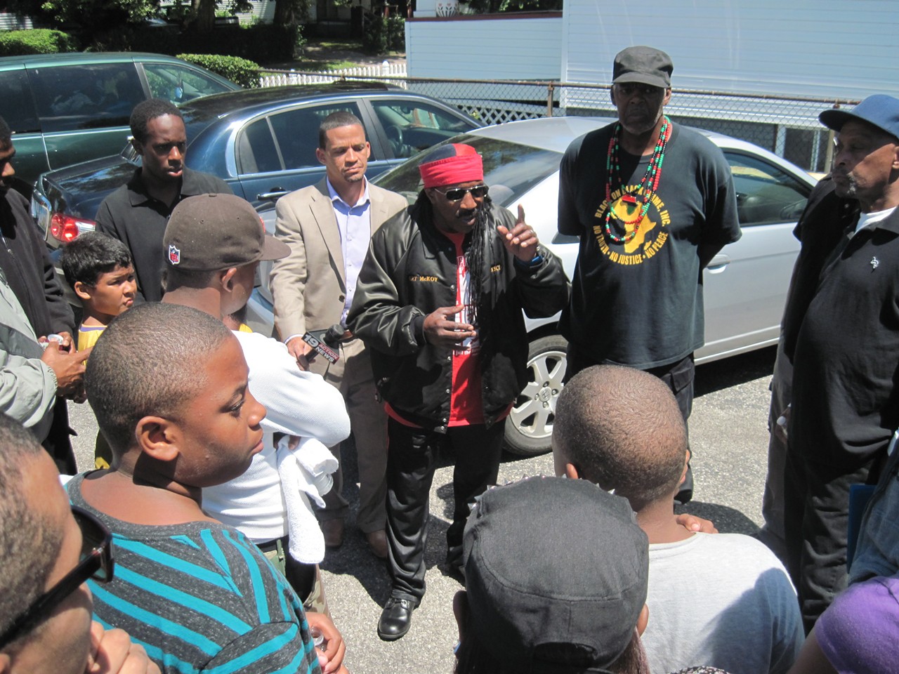 Art McKoy, founder of Black on Black Crime Inc., instructs volunteers on where they will search during the afternoon of July 24.