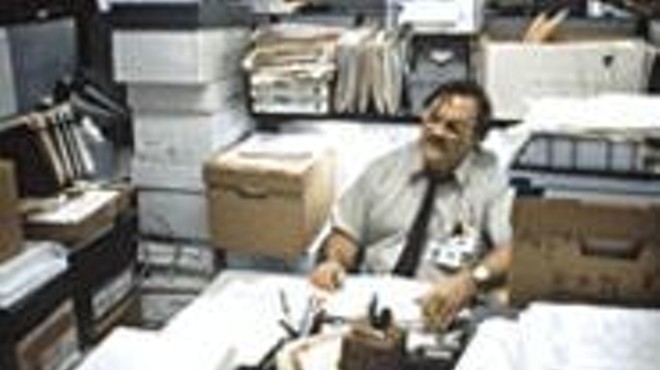 Boxed in: If you look hard, you'll find Office Space's Stephen Root buried there among all the TPS reports.