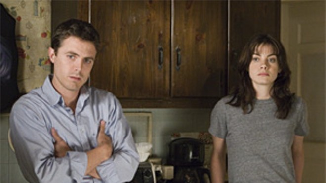 Casey Affleck and Michelle Monaghan react to Kenny Lofton's two-run homer.