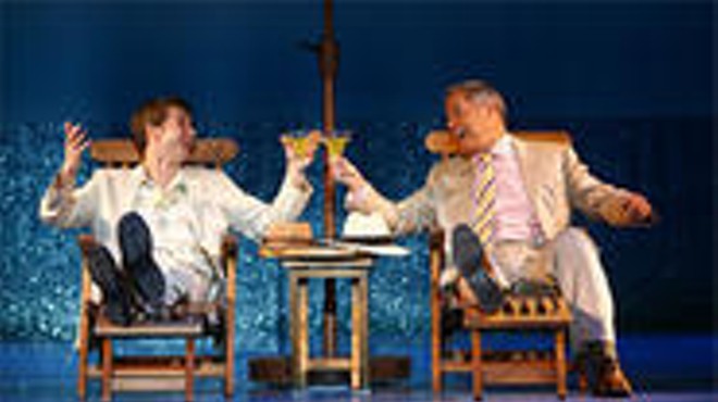 D. B. Bonds (left) and Tom Hewitt toast their own deviousness in Dirty Rotten Scoundrels.