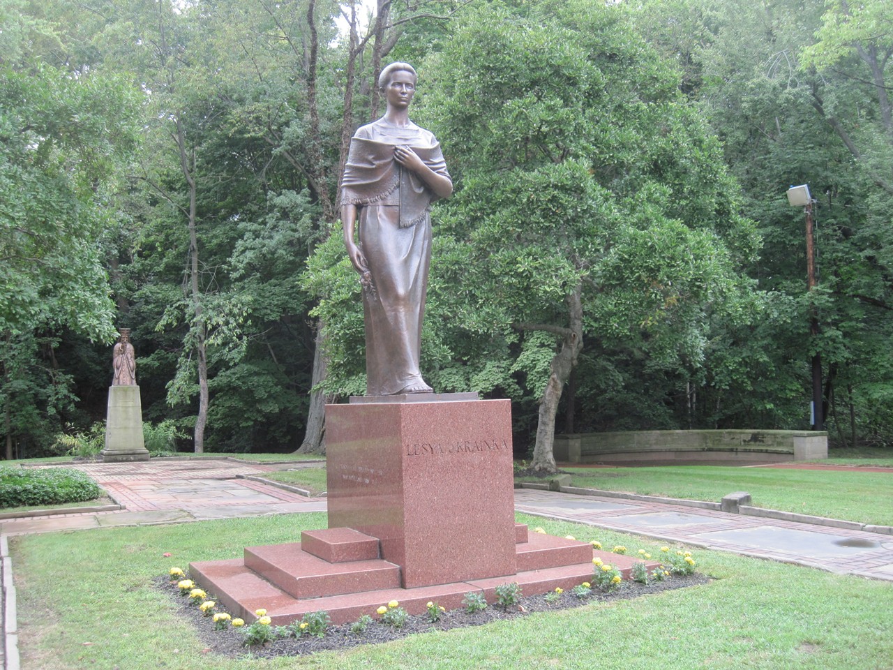 Lesya Ukrainka stands over the garden.