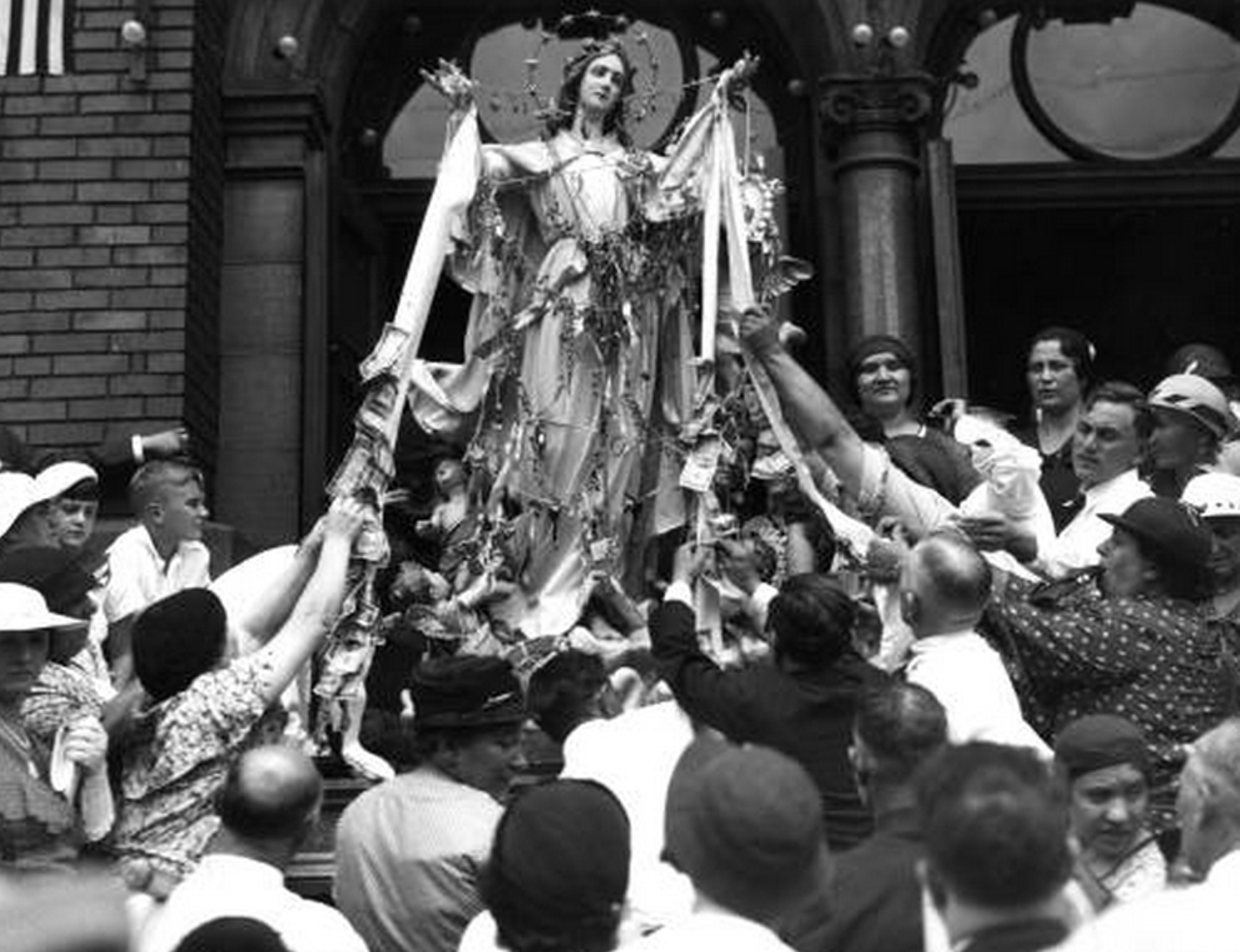 Locals provide offerings to the Virgin Mary during the Feast of Assumption, 1935.