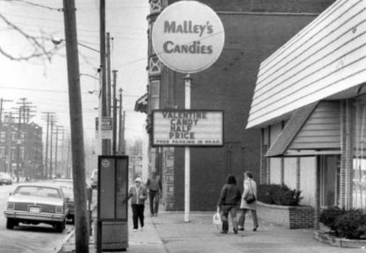 Looking west along the north side of Detroit Ave. at Malley's Candies, 1989.