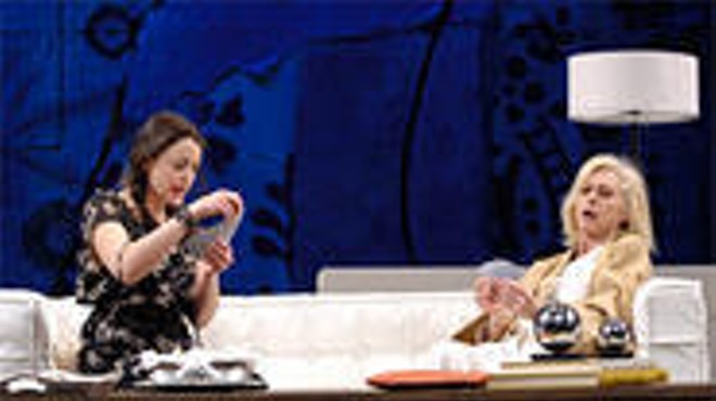 Matilde (Ursula Cataan, left) and Lane (Patricia Hodges, right) play cards in The Clean House.