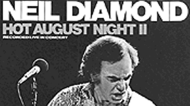 Neil Diamond singing, excavating.