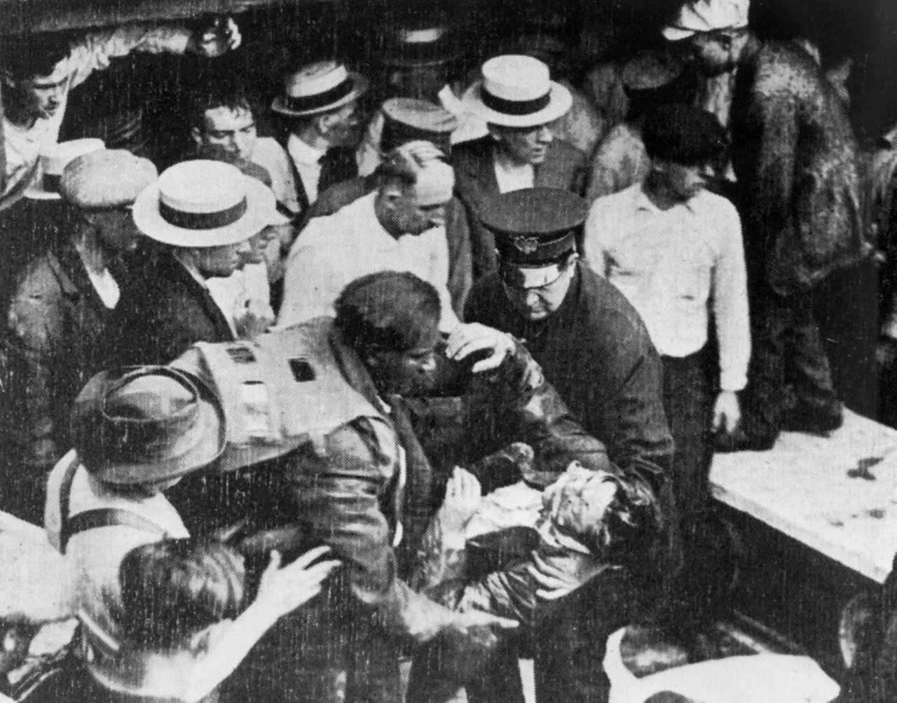Six different Waterworks Tunnel disasters occurred during the construction of water intake tunnels for Cleveland's water system, killing a total of 58 men between the years 1898 and 1916. In this photo, a group is helping a victim of the July 24, 1916 explosion that killed 21 people.