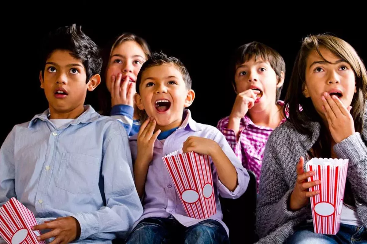 children-watching-a-movie.webp