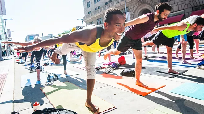 Image: #SHINEBRITE Yoga Under the GE Chandelier