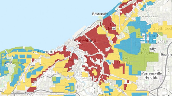 The red color indicates neighborhoods redlined in the 1930s.