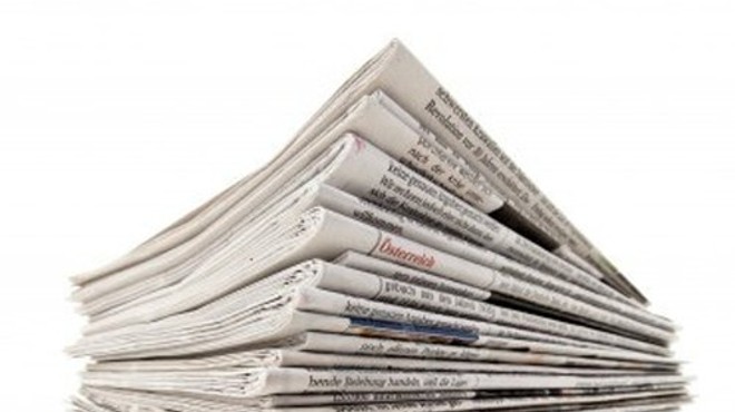 A stock photo of a stack of newspapers, not meant to be nostalgic.