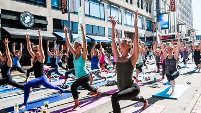 Image: #SHINEBRITE Yoga Under the GE Chandelier