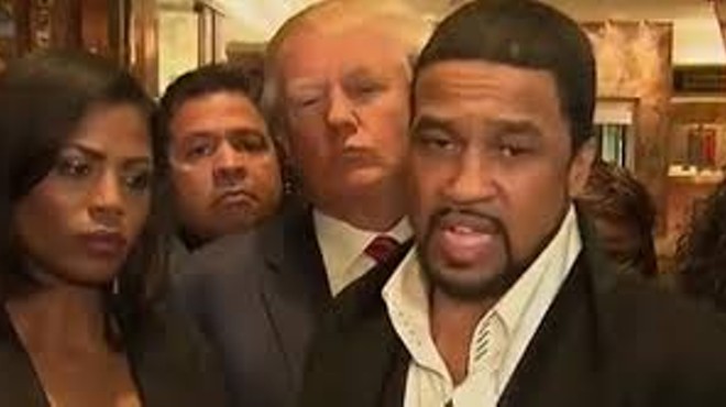 The Rev. Darrell Scott, with Donald Trump looming in the background.