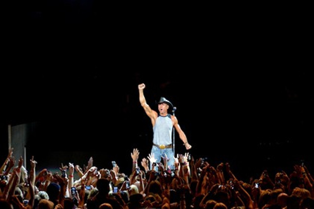 When country superstar Tim McGraw played Blossom last summer, he braved the rain to strut from the side of the stage and cut through the crowd, slapping high fives along the way. Wearing a black cowboy hat and a tank top that exposed his beefy, well-toned arms, the guy looked like he was on his way to a wrestling match as the Imagine Dragons anthem “Radioactive” played over the PA system. McGraw opened with the poppy “Where the Green Grass Grows” and then he and his stellar eight-piece band ran through all of his biggest hits. His new album, Sundown Heaven Town isn’t due out until September but expect to hear some tracks from it at tonight’s show. (Niesel) $44.25-$69.50