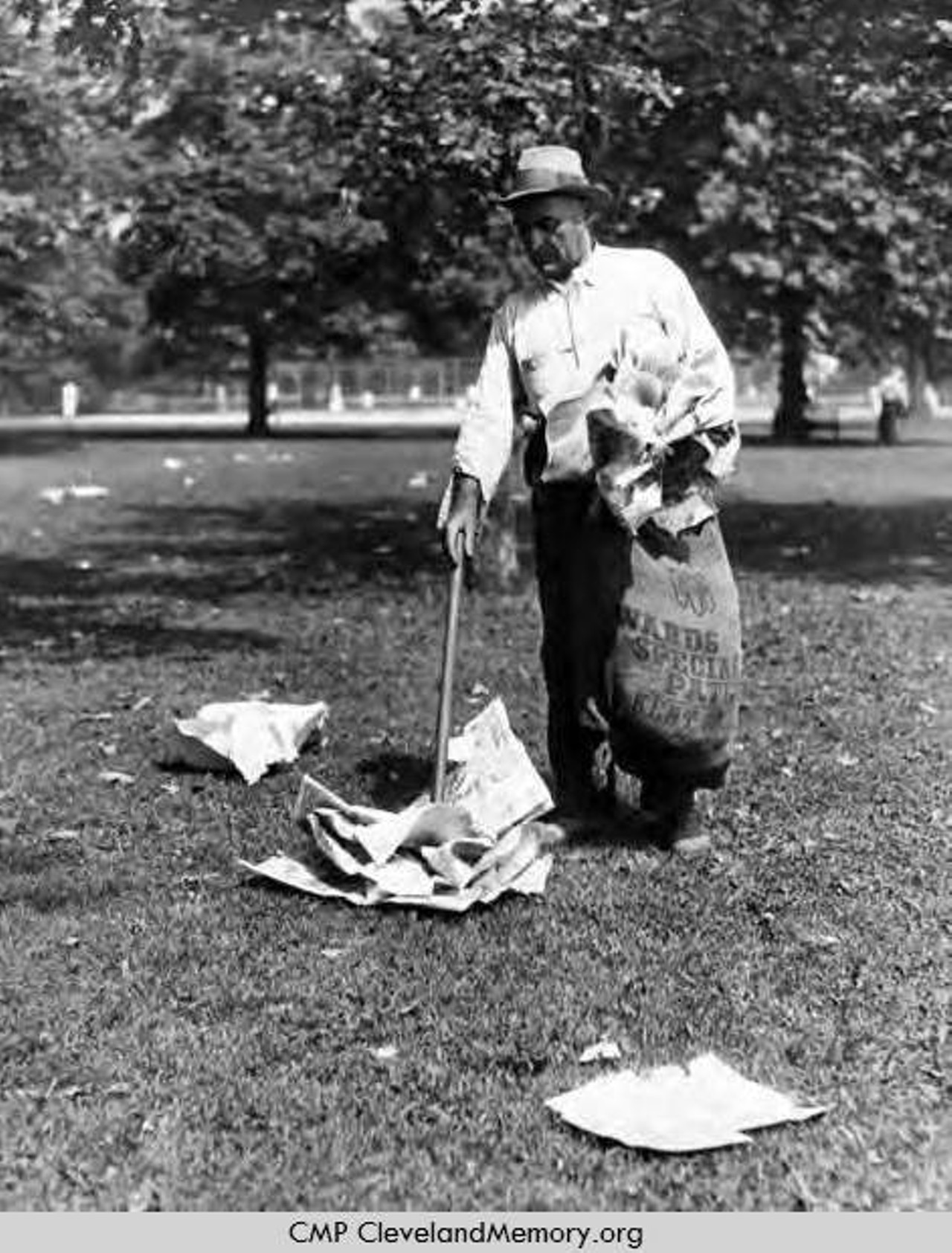 Man cleans up litter at Edgewater Park, 1932