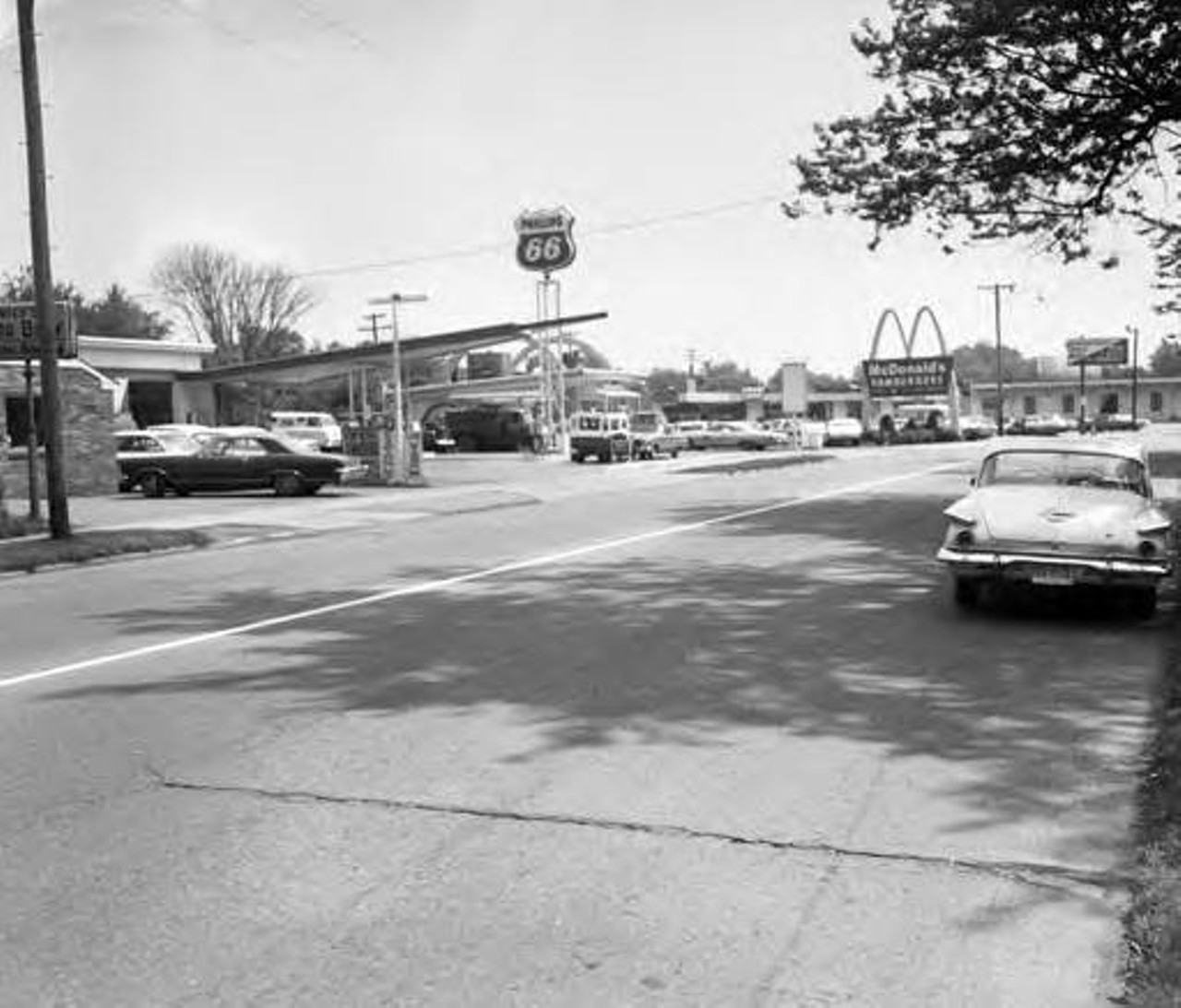Looking east along Sloane from ParkRow Ave. Phillips 66 gasoline service station and the original MacDonald's drive-in restaurant can be seen of the north side. c. 1969