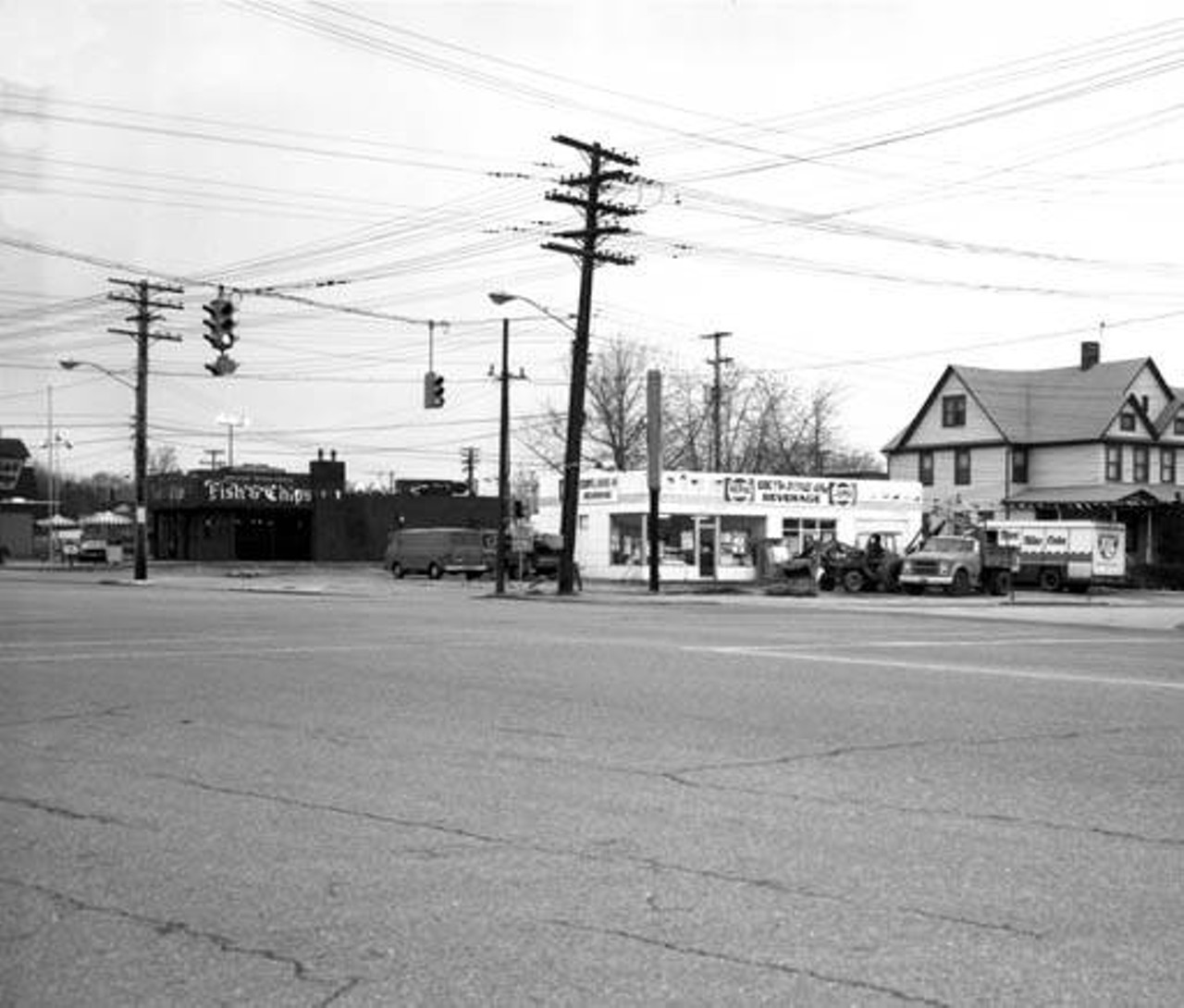 Looking towards Eddy's Drive-in Beverage Store on the southwest corner of the West 117th St. (Highland Ave.) and Madison Ave. intersection. c. 1964