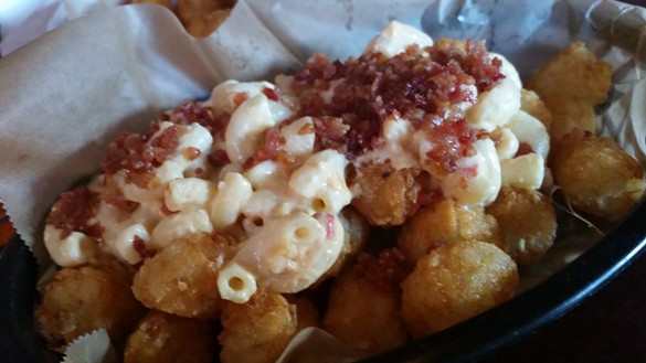 Tater Tots topped with Mac and Cheese and Bacon - Happy Dog, 5801 Detroit Ave., 216-651-9474, happydogcleveland.com