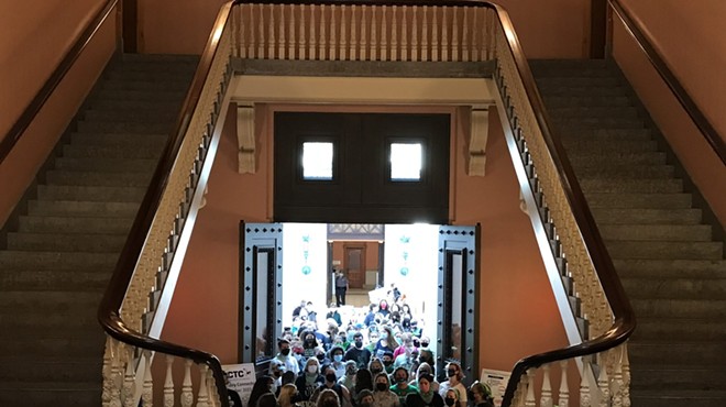 Abortion and pro-choice advocates walk into the rotunda of the Ohio Statehouse, on their way to demonstrate near the Senate chambers. The group protested the introduction of what would be a total abortion ban if Roe v. Wade is overturned.