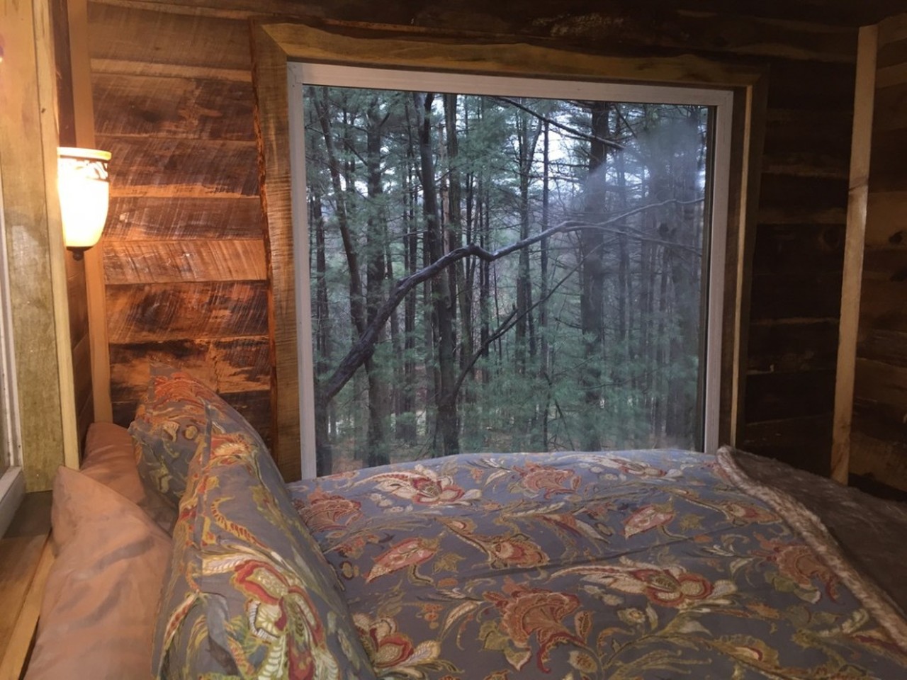 A queen bedroom with lovely wooded views is set up on floor one.