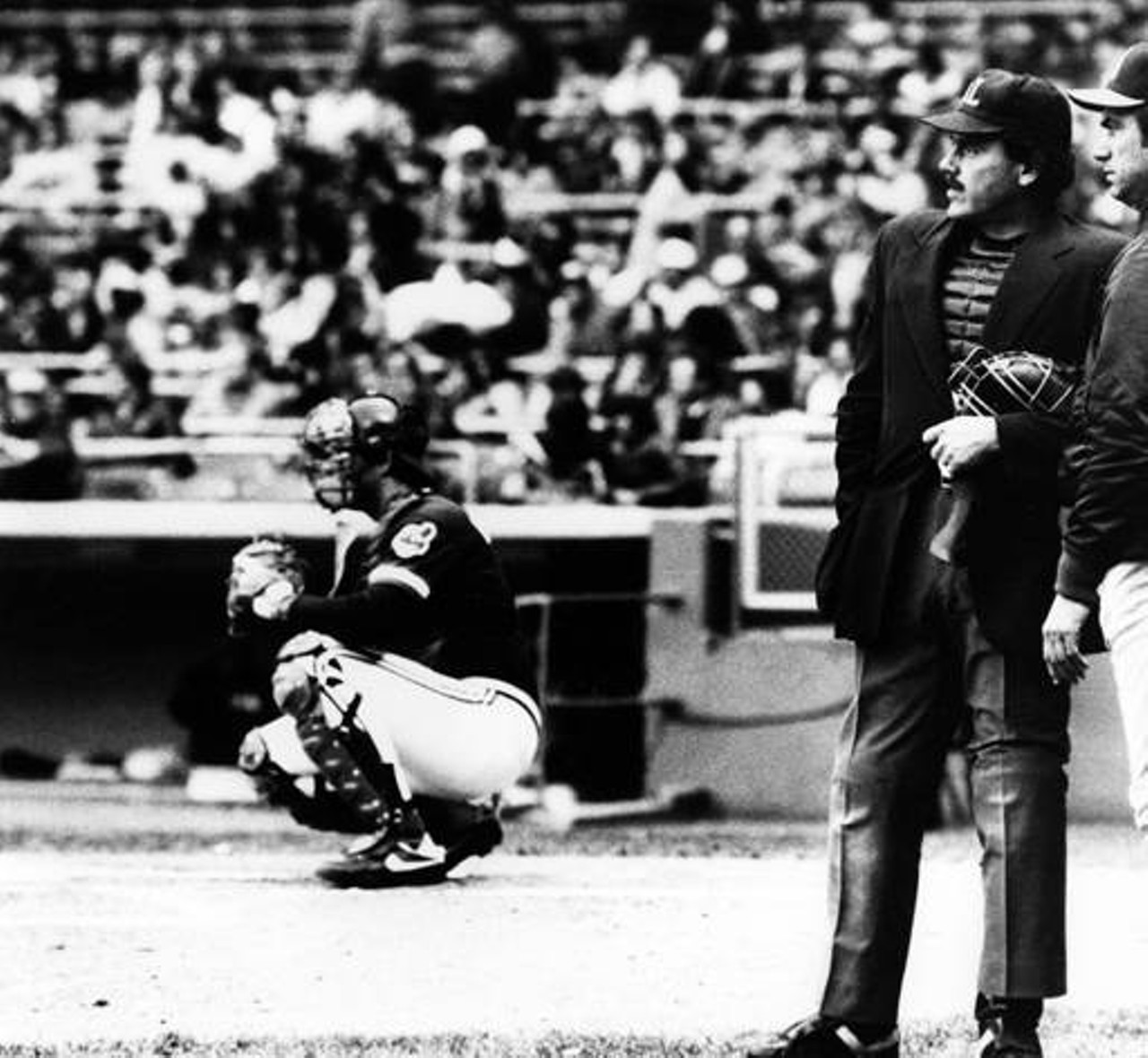 California Angels manager Jim Fregosi (right) talks with umpire Nick Bremigan about field conditions at Cleveland Municpal Stadium. 1981