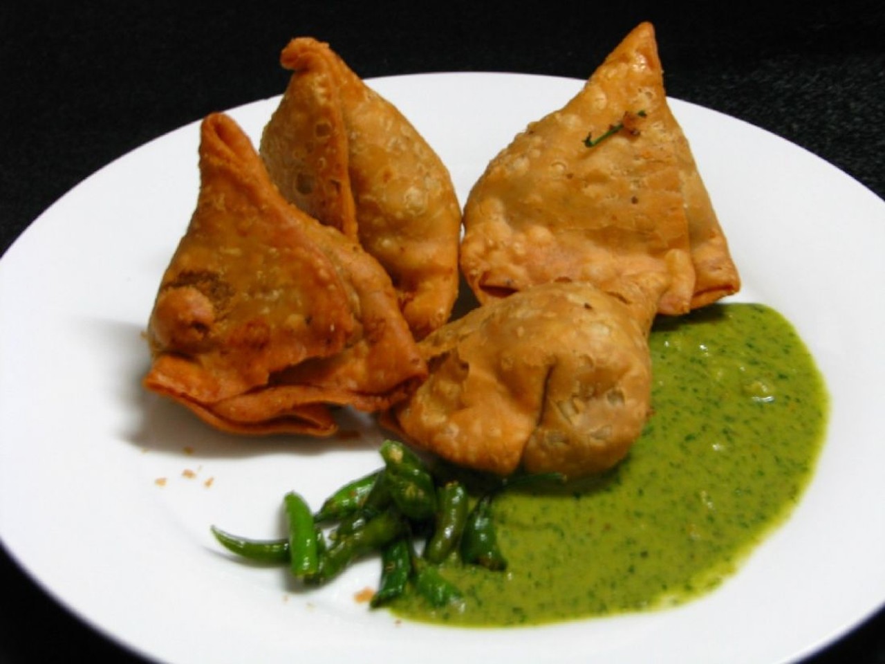  Samosas at Annapurna
7464 Ridge Rd., Parma 
Annapurna has moved to the top of our list when it comes to South Indian food in Cleveland. And the first dumpling that comes to mind in Indian cuisine is always the samosa, a crispy pastry/potatoes/green peas which Annapurna knocks out of the park. In addition to samosas, Annapurna serves three other types of stuffed dough. Pakora is stuffed with mixed veggies and deep fried, a puff is puff pastry filled with green peas and potatoes and khasta kachori are fried puffed pastry filled with spices. Try them all.
Photo via KSPoddar/Flickr