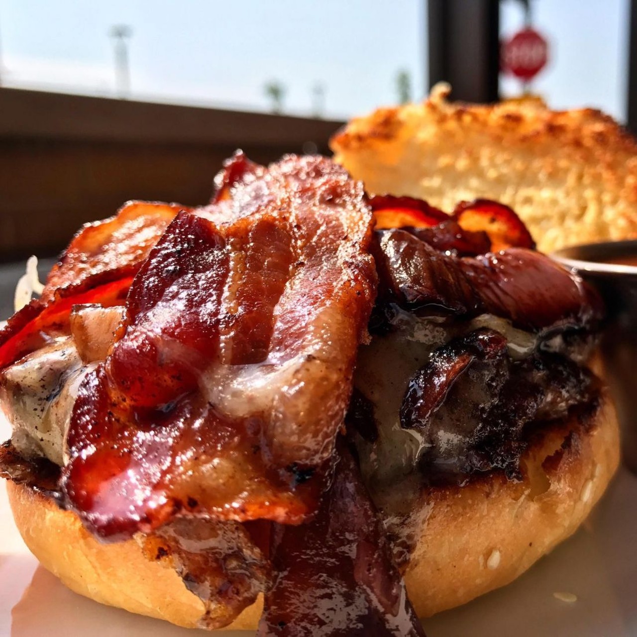  Flip Side 
Multiple Locations
Flip Side is offering their house burger which comes with two year aged Cheddar cheese, apple wood bacon, charred balsamic vinegar red onions and house made barbeque sauce.
Photo Provided by Restaurant