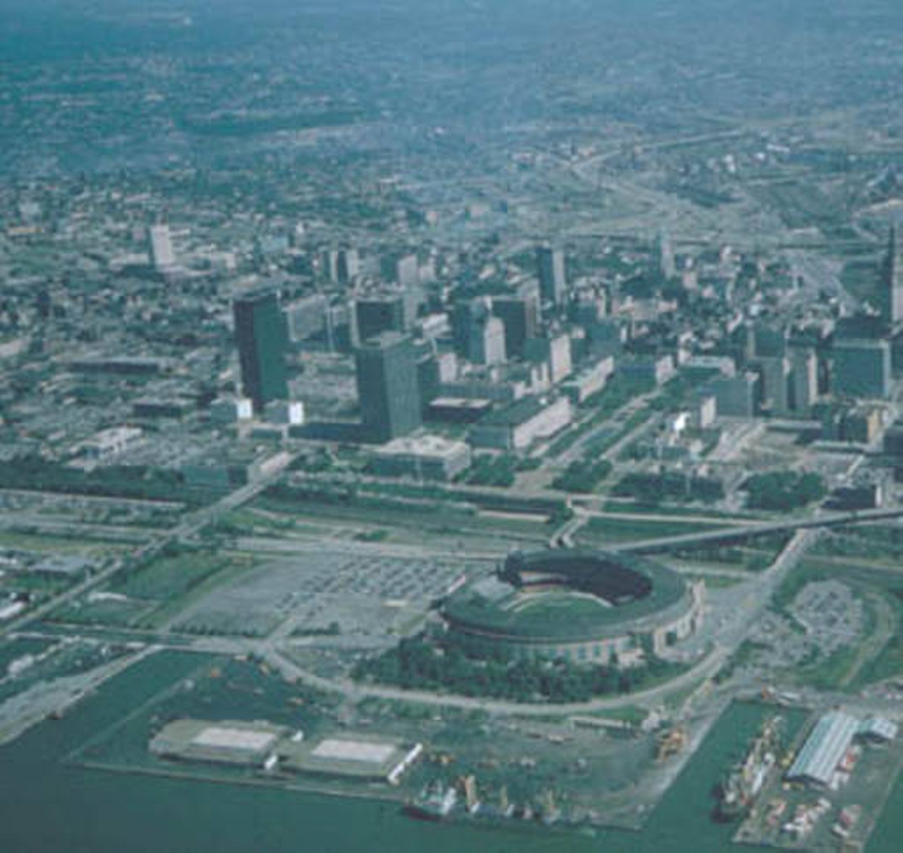 Aerial view from over Lake Erie looking south at the Cleveland Municipal Stadium and Lakefront. 1973