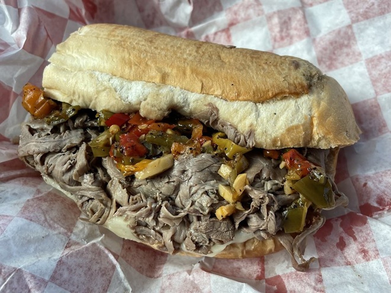  Au Jus 
5875 Broadview Rd., Parma
As Scene's Doug Trattner noted in his recent review, "I can’t imagine how much meat is wedged into the “large” Italian beef sandwich given that my “regular” ($9.25) was overflowing with tender, thin-shaved beef. Order it “dipped” and it will be baptized in a font of the namesake au jus. Otherwise, sandwiches come with a large tub of the thin gravy for self-dipping. Make sure to add an order of the giardiniera ($1.10) – or better yet, the spicy-hot giardiniera. Au Jus also features a streamlined menu of “state fair-style” sausage and pepper hoagies, a few pressed sandwiches, fresh-cut fries and exceptional batter-dipped onion rings ($3.99)."