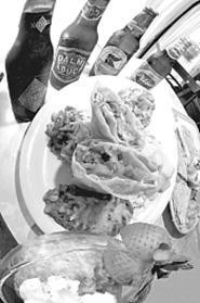 A vegetarian chimichanga with all the fixin's goes great with oh, four beers. - Walter  Novak