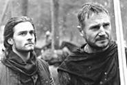Bloom and Neeson play Crusaders with unlikely - pacifist tendencies.