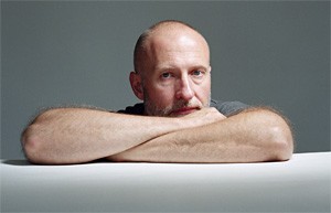 Bob Mould could use a shorter table or a bigger chair.