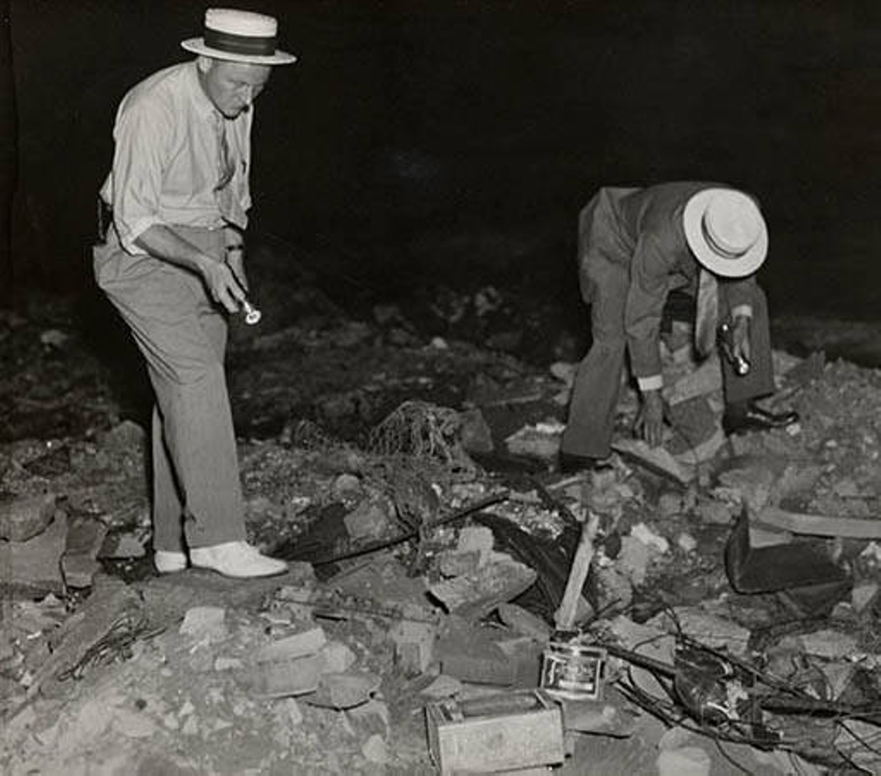 Detectives Herbert Wacksman and George Buckingham at dump