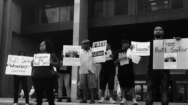 Protesters stand outside of the Justice Center before RuEl Sailor's exoneration for murder in March 2018.
