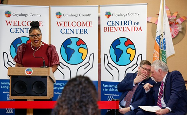 Cuyahoga County Councilwoman Meredith Turner speaking on Wednesday, next to Global Cleveland head Joe Cimperman and County Executive Chris Ronanyne.