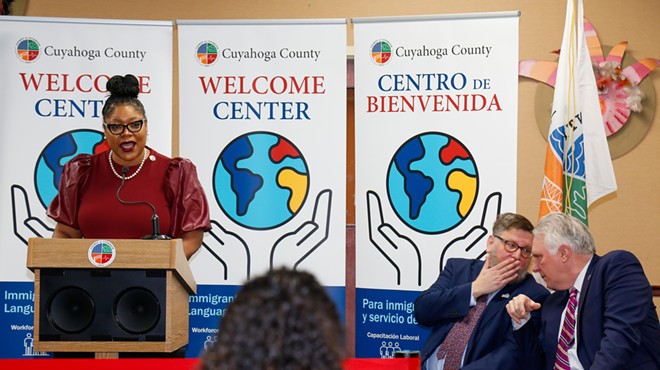 Cuyahoga County Councilwoman Meredith Turner speaking on Wednesday, next to Global Cleveland head Joe Cimperman and County Executive Chris Ronanyne.