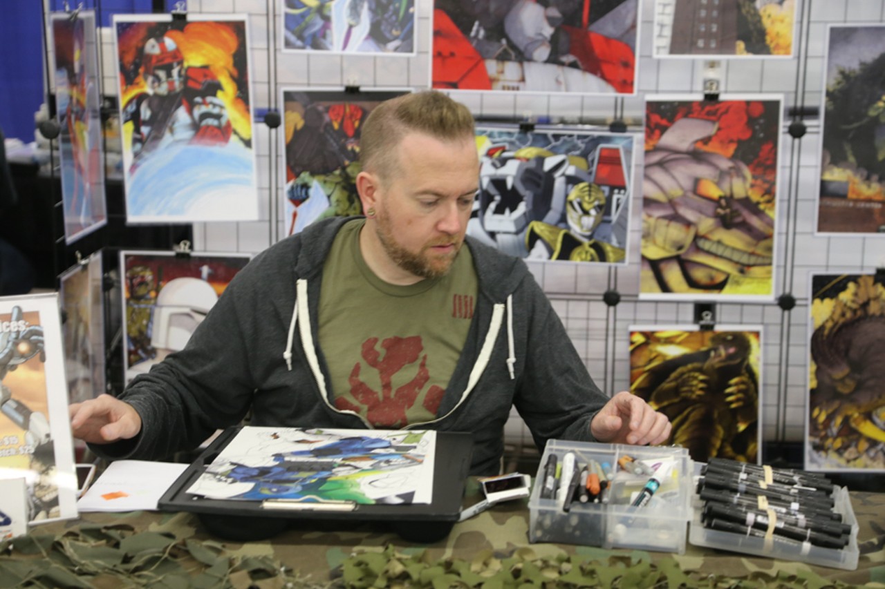 At work at Cleveland Comic Con, photo by Emanuel Wallace.