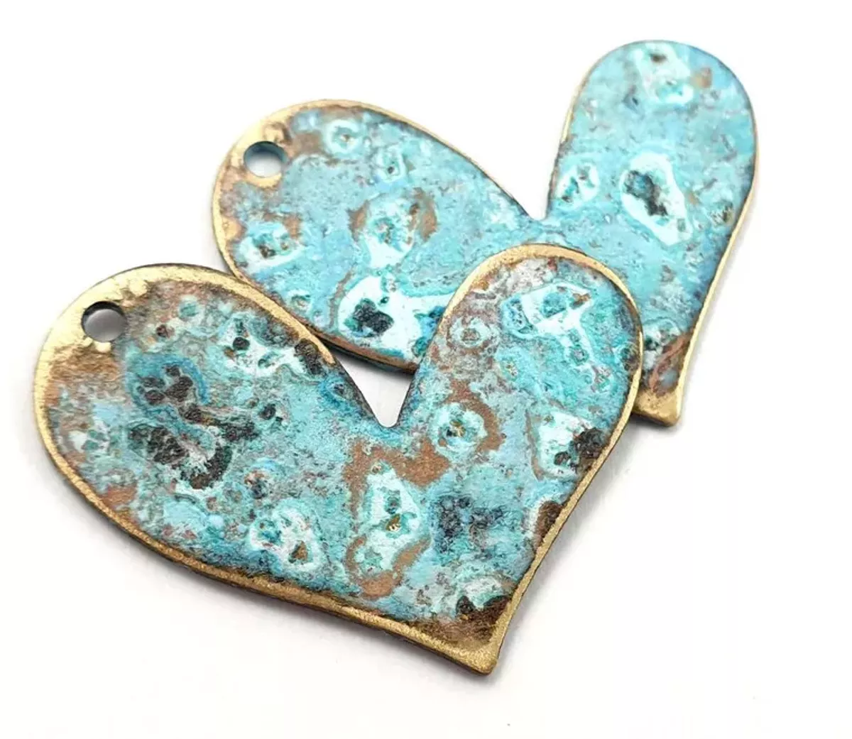 These stunning brass hearts are treated to create a rich patina. Available at Many Hands Marketplace at GemStreet USA, coming to Cleveland March 8-10.