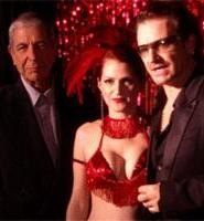 Leonard Cohen (left), takes the stage with a burlesque girl and U2's Bono.