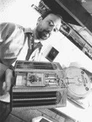 Marc Millis and a spacecraft model he made in the basement. - WALTER  NOVAK