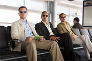 Matt Damon, George Clooney, and Brad Pitt patiently await their box-office percentage.