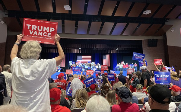 Supporters waving signs as Republican Vice Presidential nominee J.D. Vance addresses a crowd in his hometown of Middletown, OH.