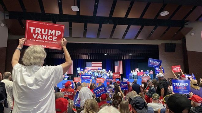 Supporters waving signs as Republican Vice Presidential nominee J.D. Vance addresses a crowd in his hometown of Middletown, OH.