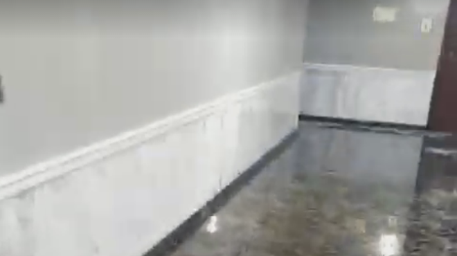 Flooding in hallways after a waterline broke in the Terminal Tower apartments in June