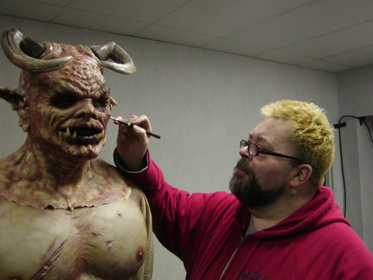 Alan Tuskes putting some finishing touches on a devil.