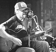 Scott H. Biram brings his trucker hat and his one-man band - to the Beachland on Thursday.