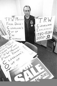 Signs of the times: UAW's John Reichbaum gets his message out. - Walter  Novak