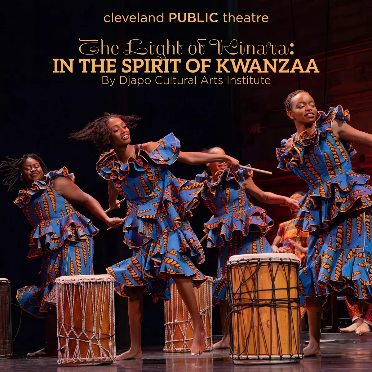 Photo of performers in African prints dancing and playing drums.