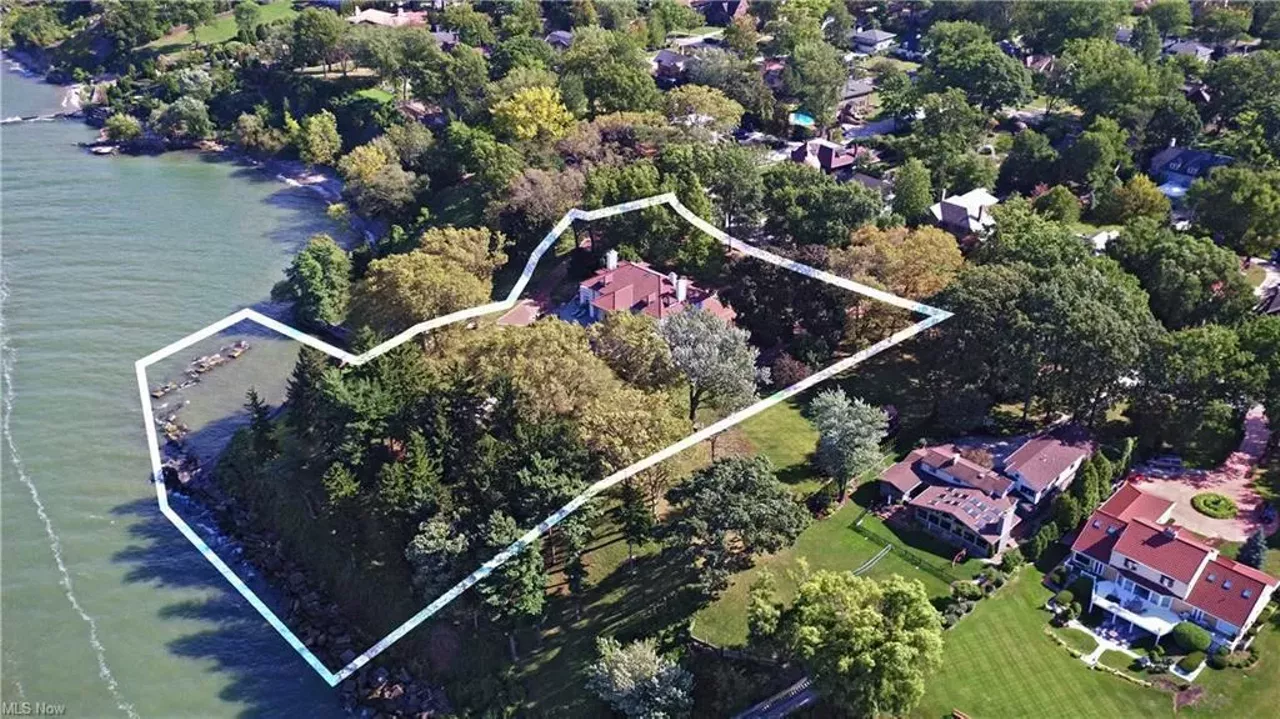 This Stately Lakefront Mansion In Edgewater Has a Sauna, Elevator and