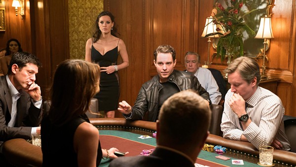 Jessica Chastain (standing) in Molly's Game